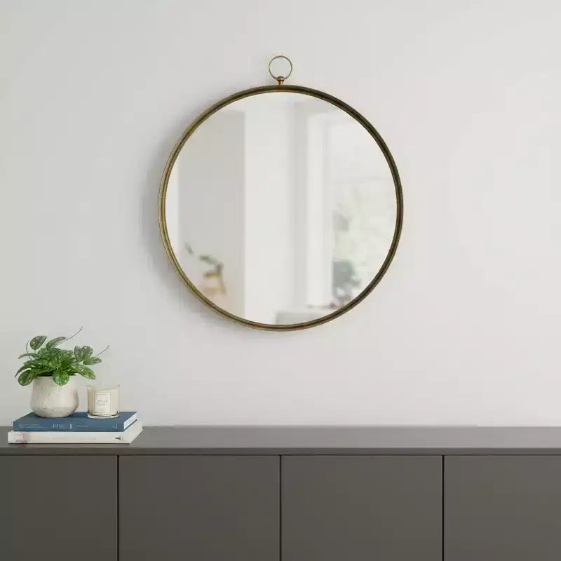 Miroir d'appoint rond avec cadre en fer doré